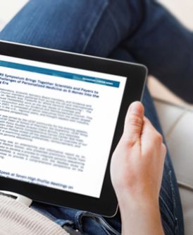 closeup of a person reading news on a tablet